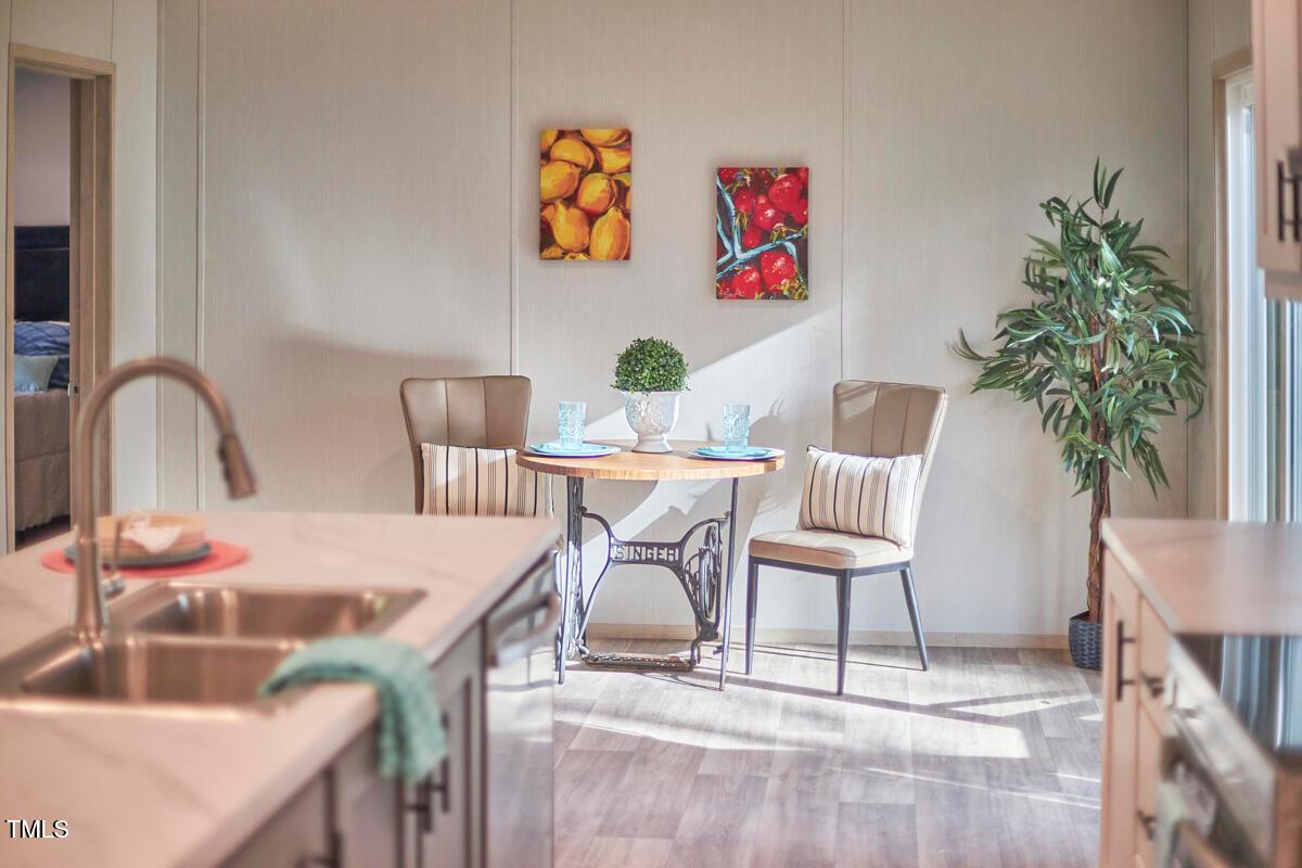 48 Bone Oak Sanford, NC 27332 - Photo 11 of 21 a table with chairs and a table