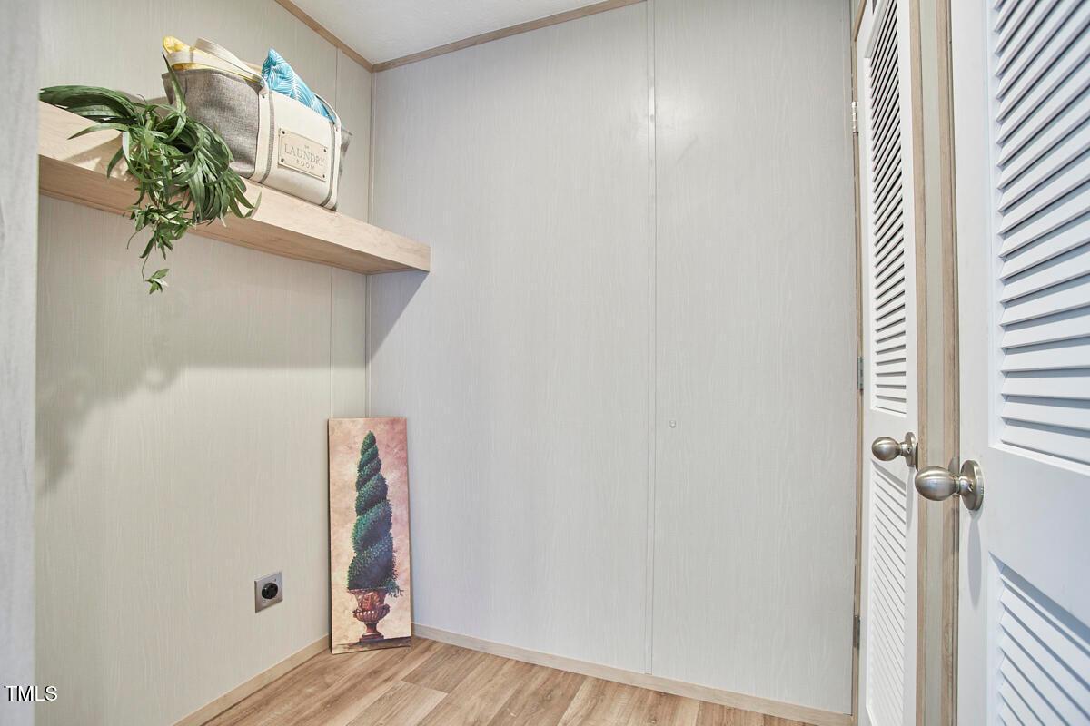 48 Bone Oak Sanford, NC 27332 - Photo 16 of 21 a view of a hallway with wooden floor and front door
