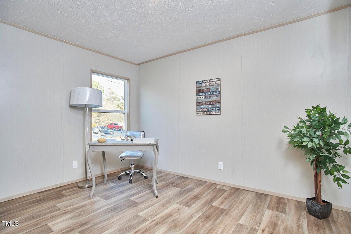 48 Bone Oak Sanford, NC 27332 - Photo 17 of 21 a workspace with furniture and a potted plant