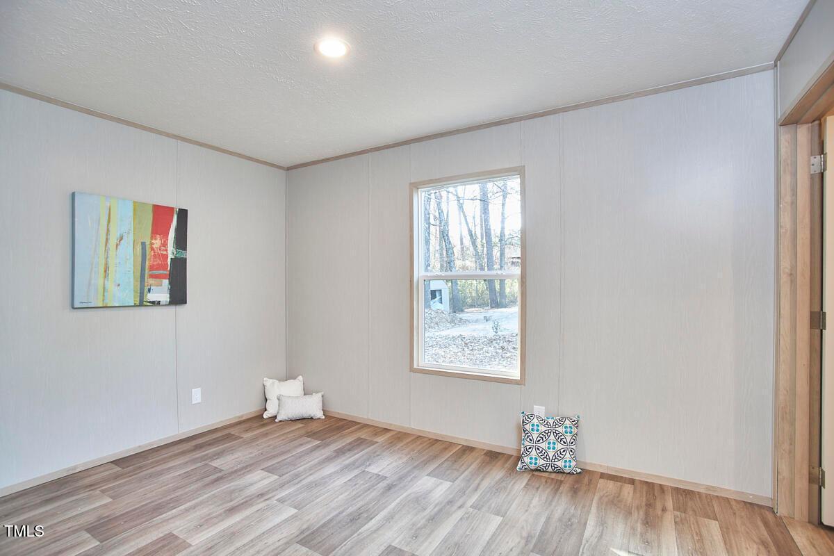 48 Bone Oak Sanford, NC 27332 - Photo 20 of 21 a view of an empty room with wooden floor and a window