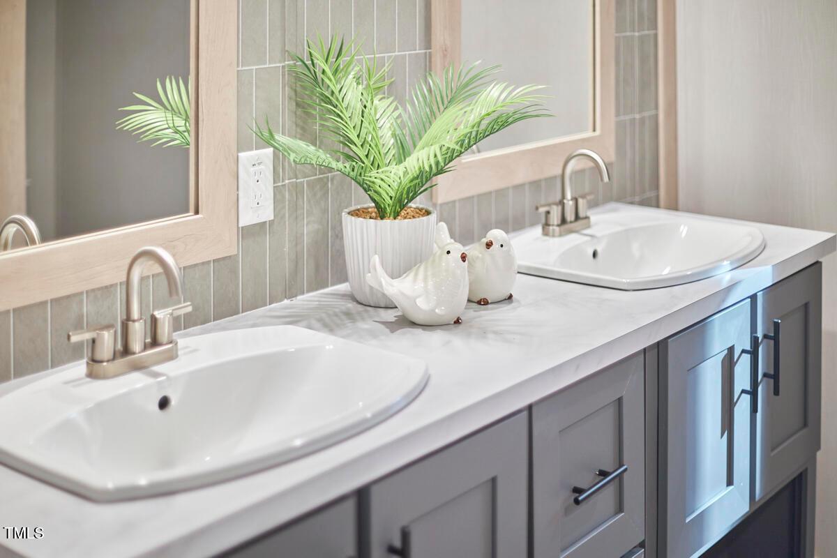48 Bone Oak Sanford, NC 27332 - Photo 21 of 21 a bathroom with a sink a vanity and a mirror