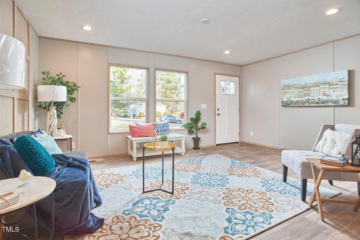 48 Bone Oak Sanford, NC 27332 - Photo 4 of 21 a living room with furniture and a rug