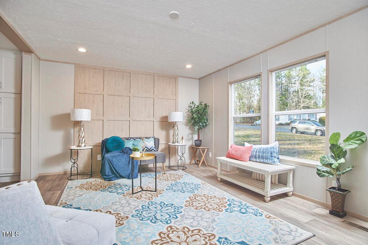 48 Bone Oak Sanford, NC 27332 - Photo 5 of 21 a living room with furniture and potted plants