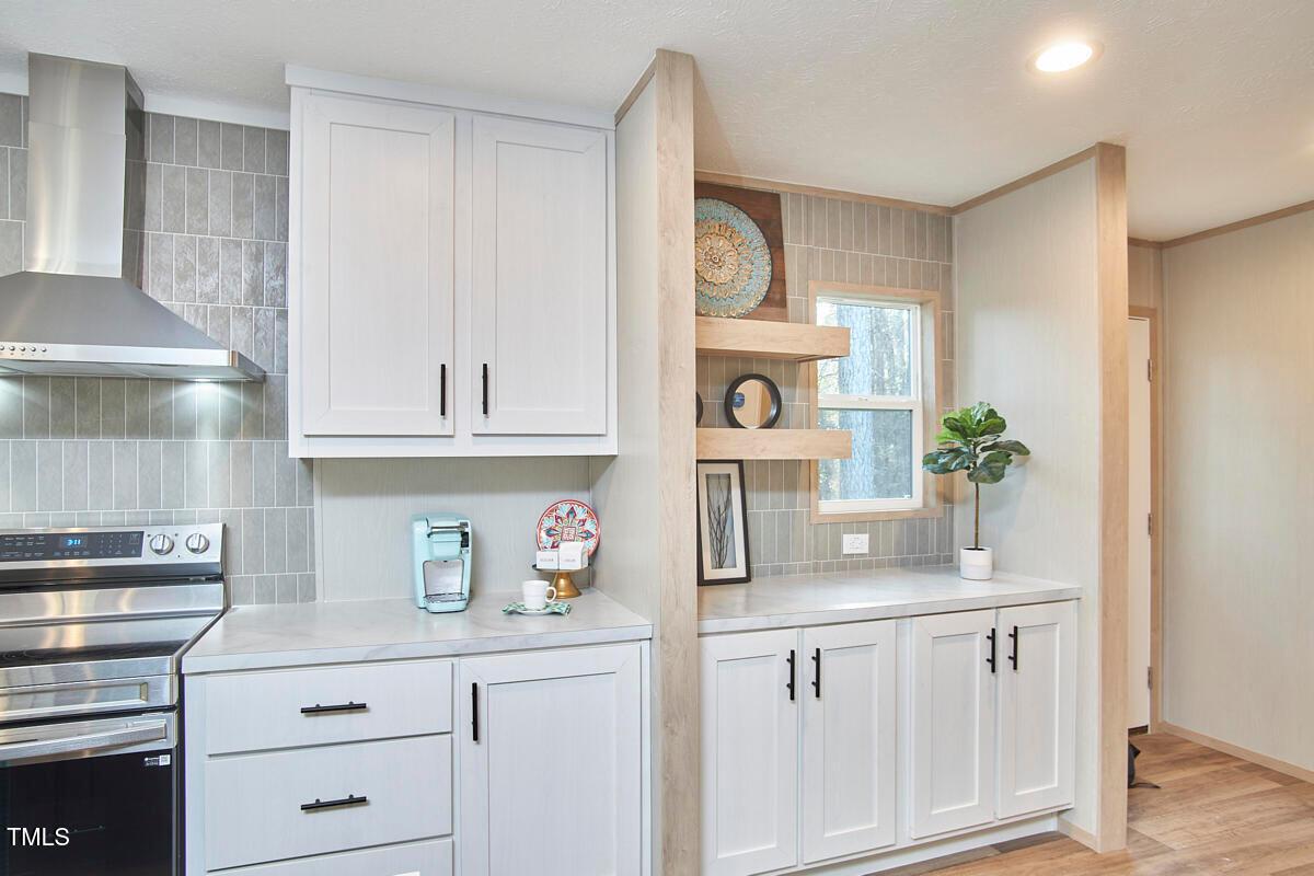 48 Bone Oak Sanford, NC 27332 - Photo 10 of 21 a kitchen with white cabinets and window