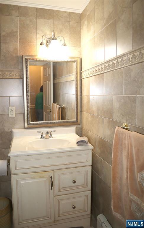 97 Squaw Brook Road North Haledon, NJ 07508 - Photo 11 of 19 a bathroom with a sink and a mirror