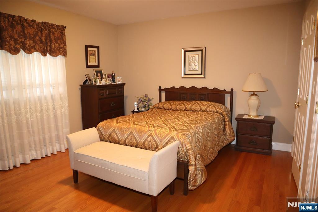 97 Squaw Brook Road North Haledon, NJ 07508 - Photo 10 of 19 a bedroom with a bed and wooden floor