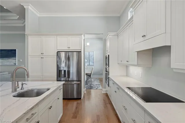 a bedroom with a bed and a ceiling fan