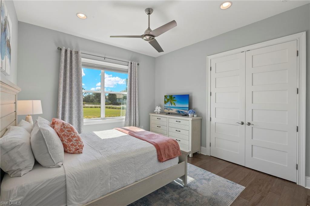 6420 Pembroke Way Naples, FL 34113 - Photo 23 of 39 Bedroom 3 of 3 with wood-flooring, ceiling fan, and a closet