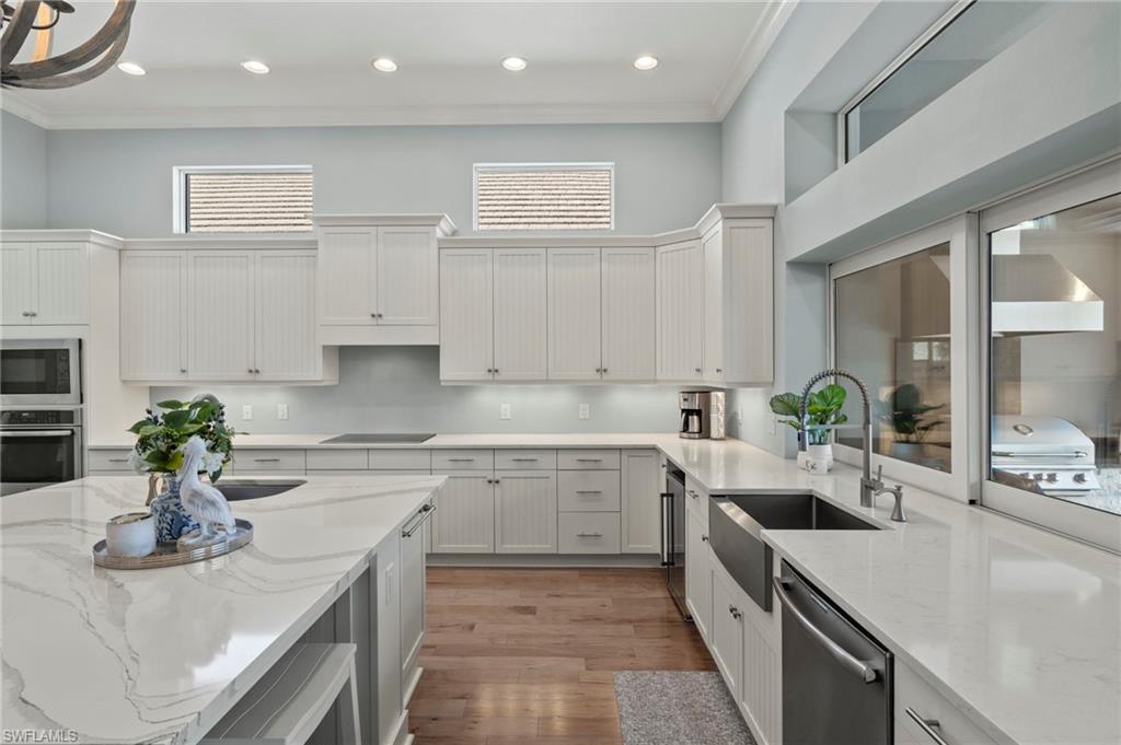 6420 Pembroke Way Naples, FL 34113 - Photo 10 of 39 Pass through window above the sink