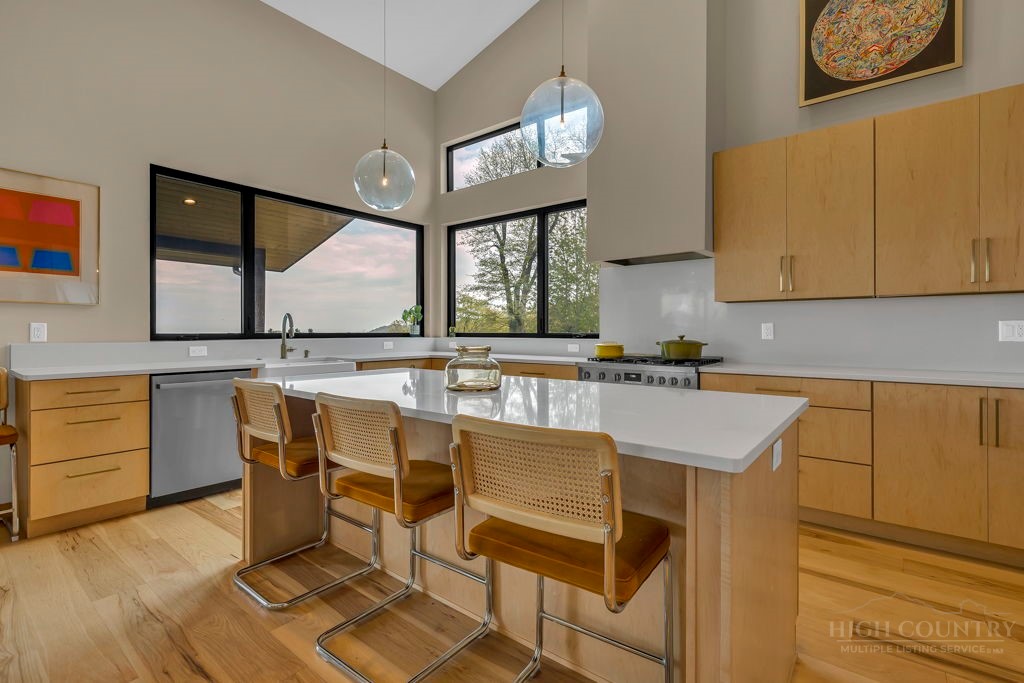 799 Milton Brown Heirs Road Boone, NC 28607 - Photo 17 of 49 a kitchen with a sink cabinets and window