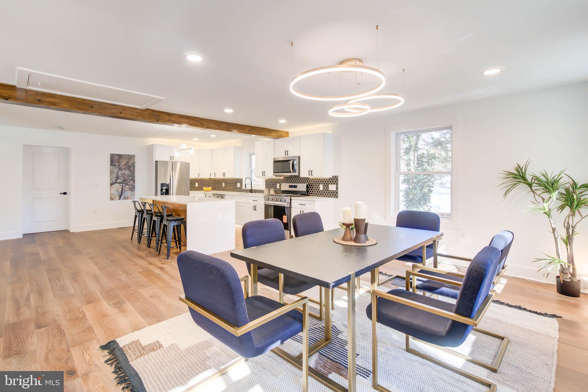 1206 La Grande Road Silver Spring, MD 20903 - Photo 11 of 45 a view of a dining room with furniture and a table