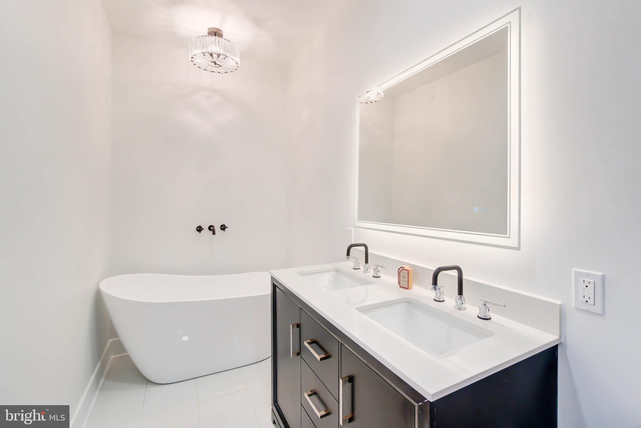 1206 La Grande Road Silver Spring, MD 20903 - Photo 18 of 45 a bathroom with a sink and a mirror