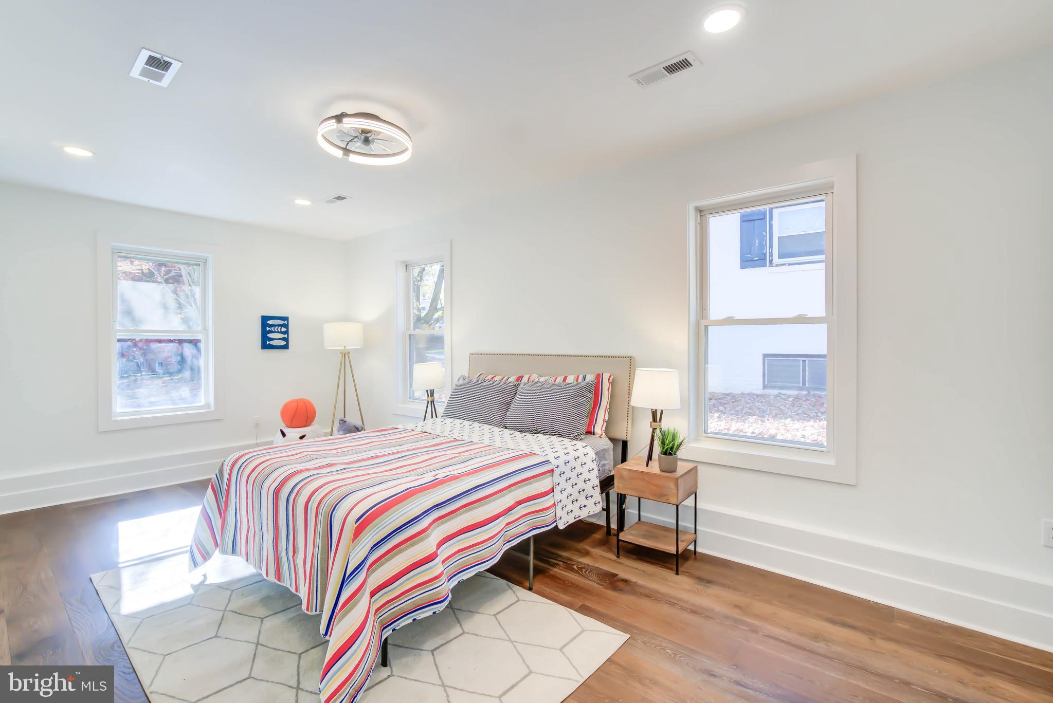 1206 La Grande Road Silver Spring, MD 20903 - Photo 20 of 45 a bedroom with a bed and a window