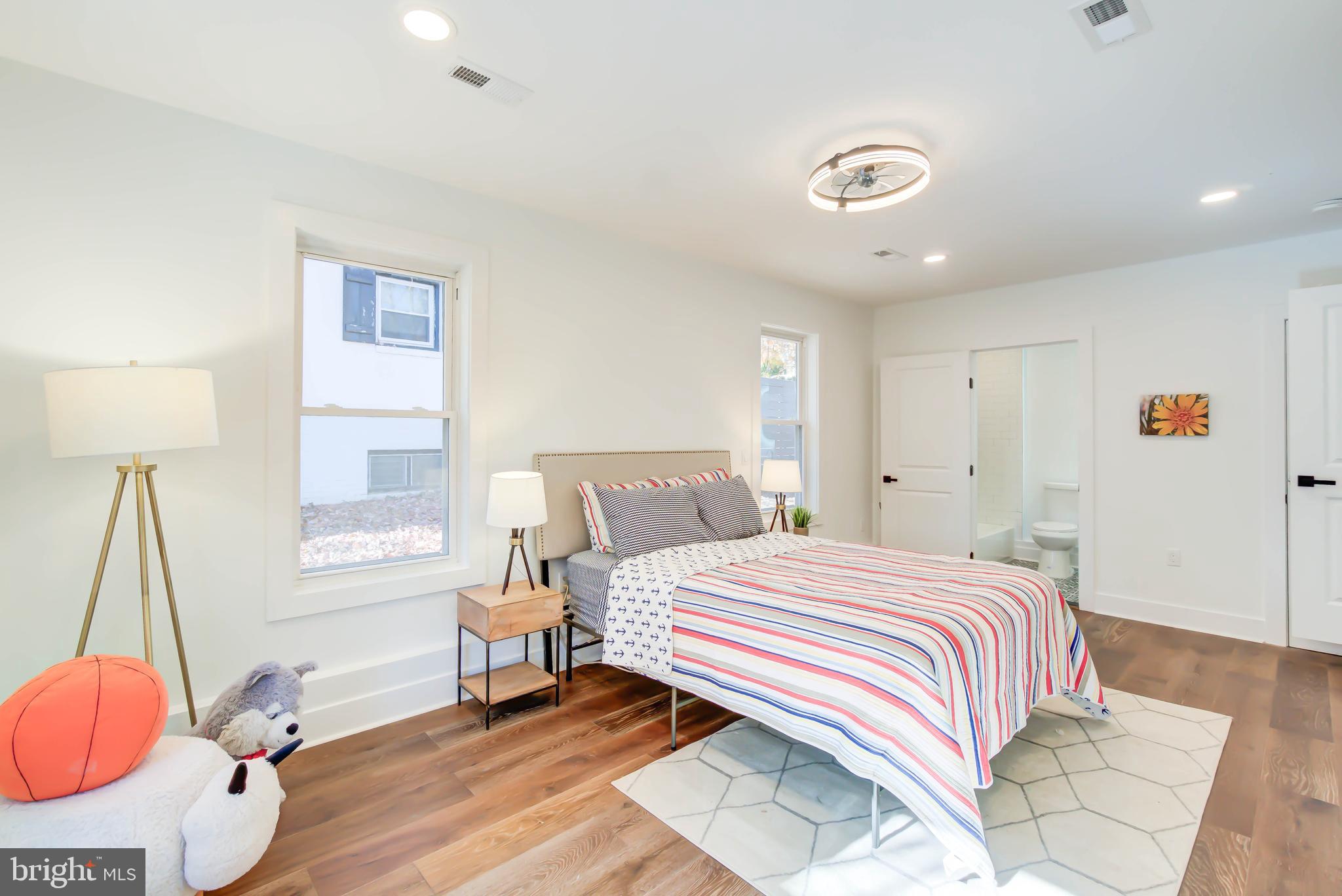 1206 La Grande Road Silver Spring, MD 20903 - Photo 22 of 45 a bedroom with a bed and a lamp