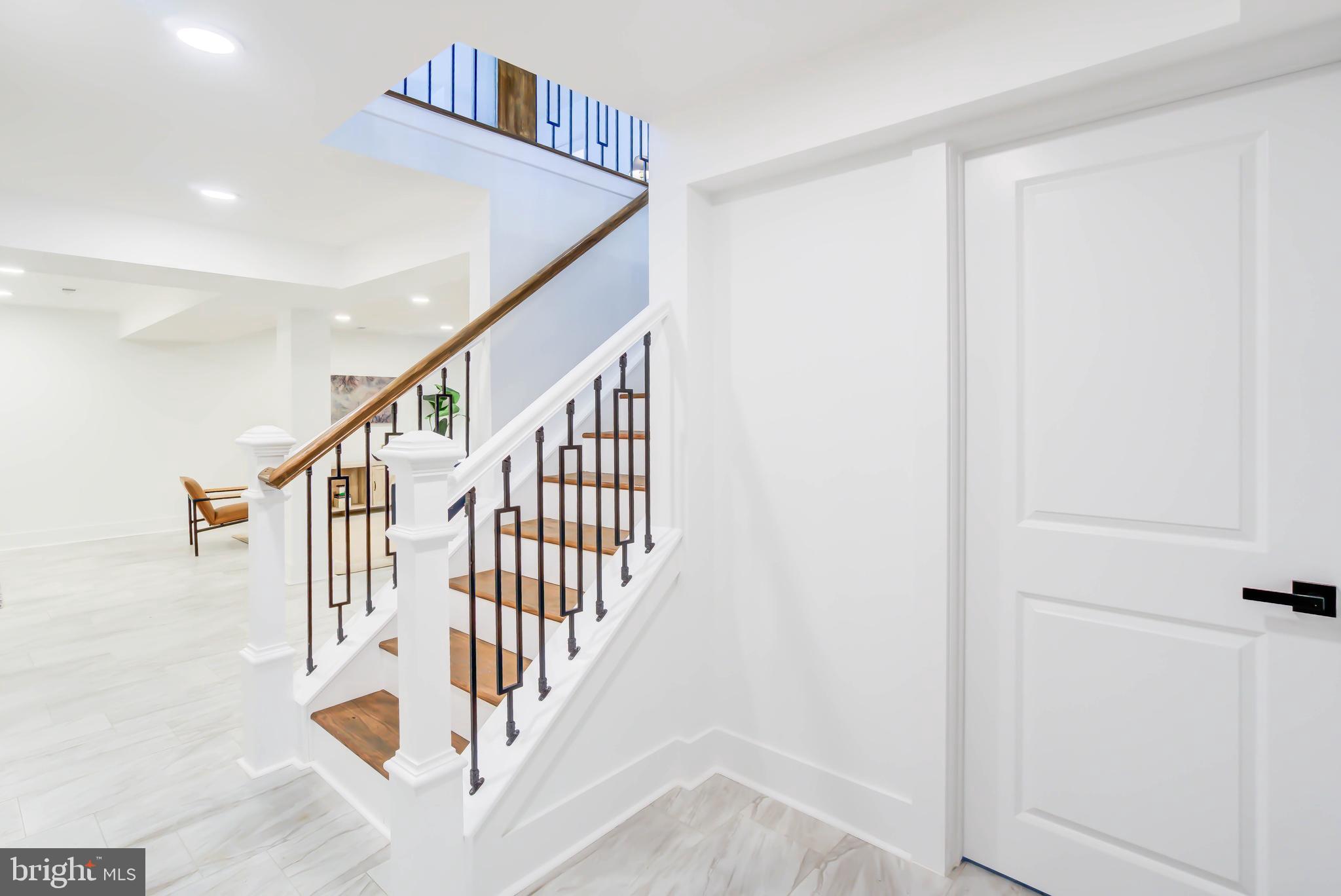 1206 La Grande Road Silver Spring, MD 20903 - Photo 25 of 45 a view of staircase with white walls and white walls