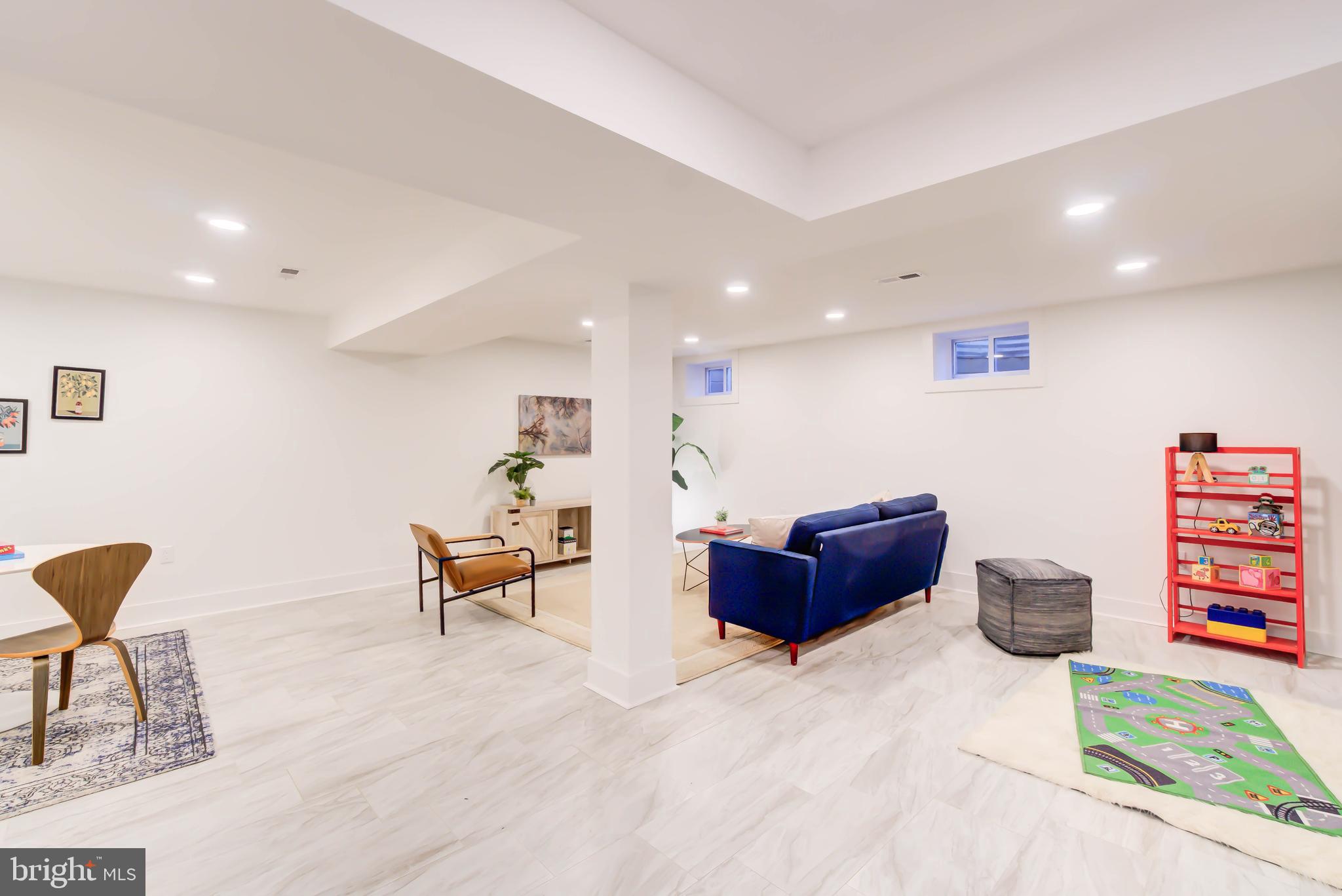 1206 La Grande Road Silver Spring, MD 20903 - Photo 27 of 45 a living room with furniture and a chair