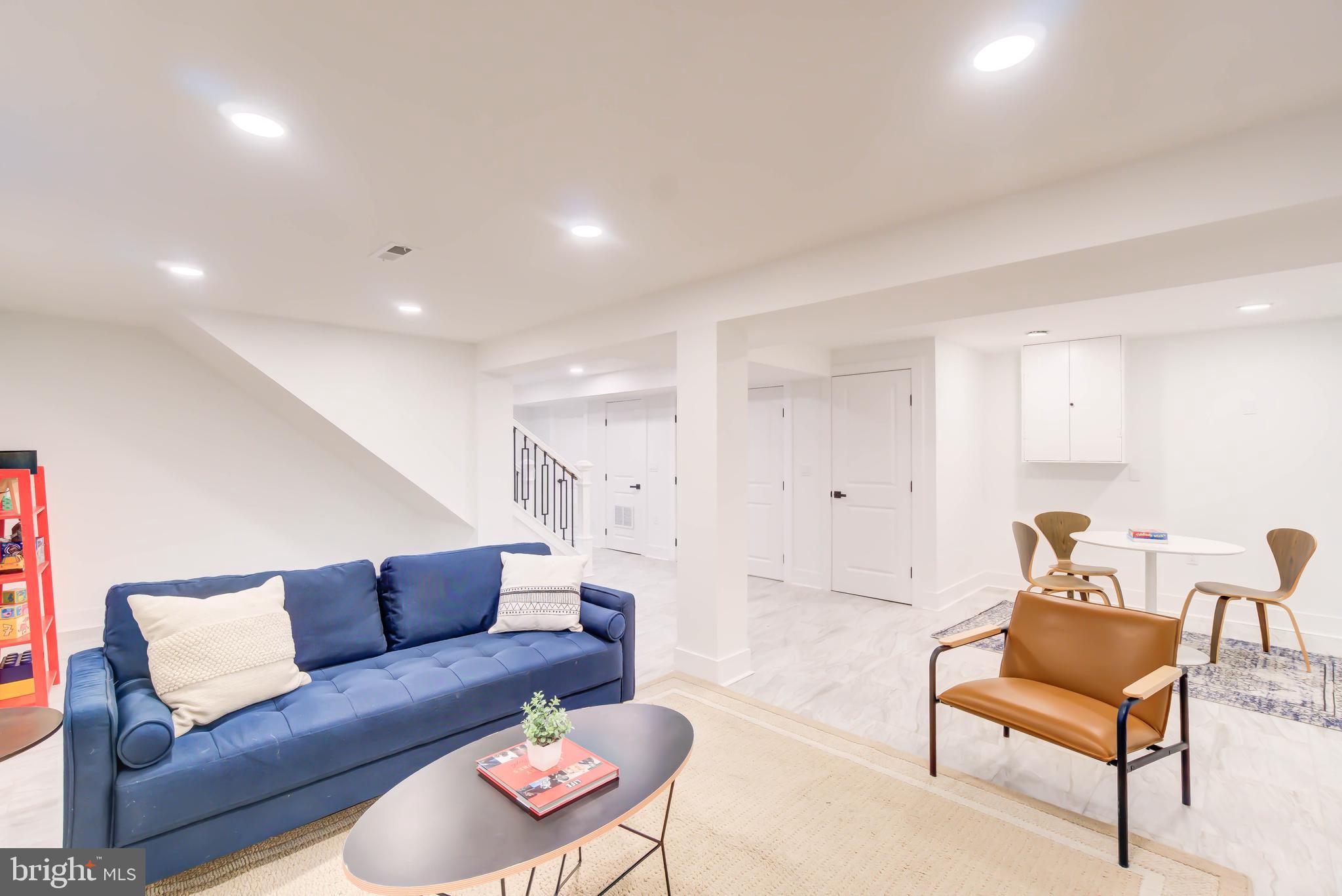 1206 La Grande Road Silver Spring, MD 20903 - Photo 28 of 45 a living room with furniture and a wooden floor