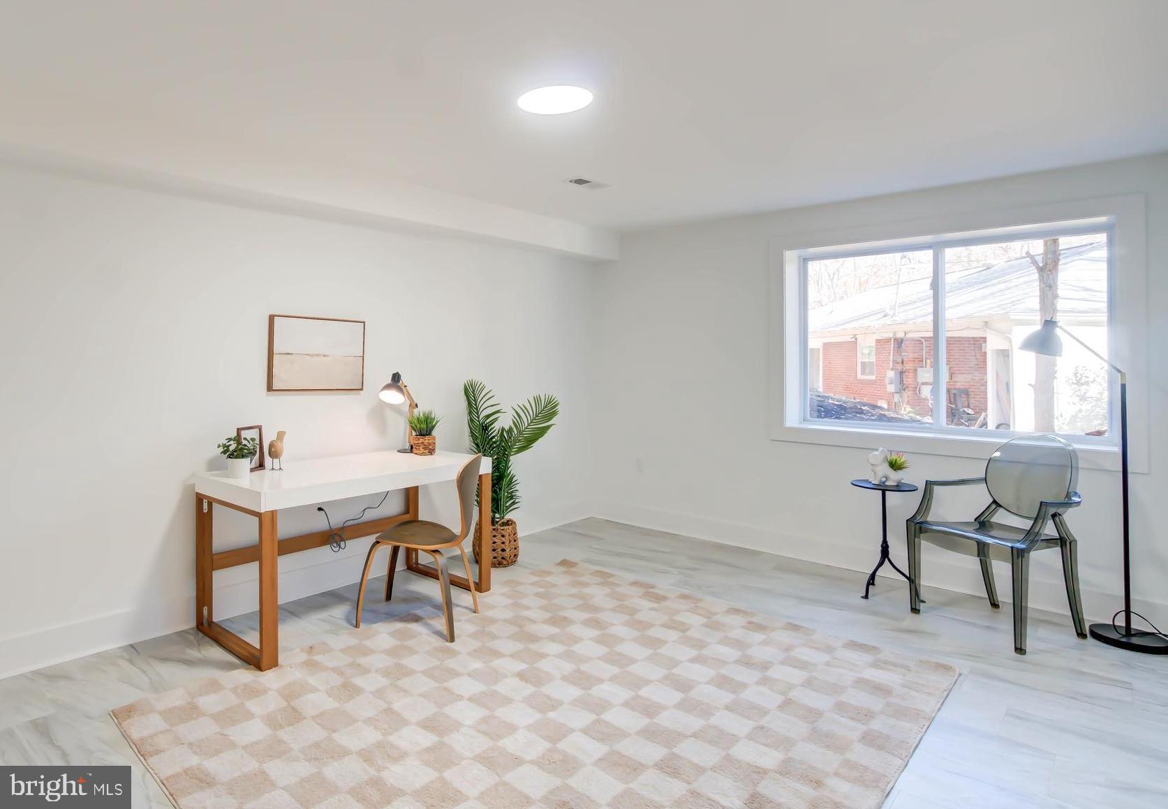 1206 La Grande Road Silver Spring, MD 20903 - Photo 30 of 45 a view of a workspace with furniture and a window