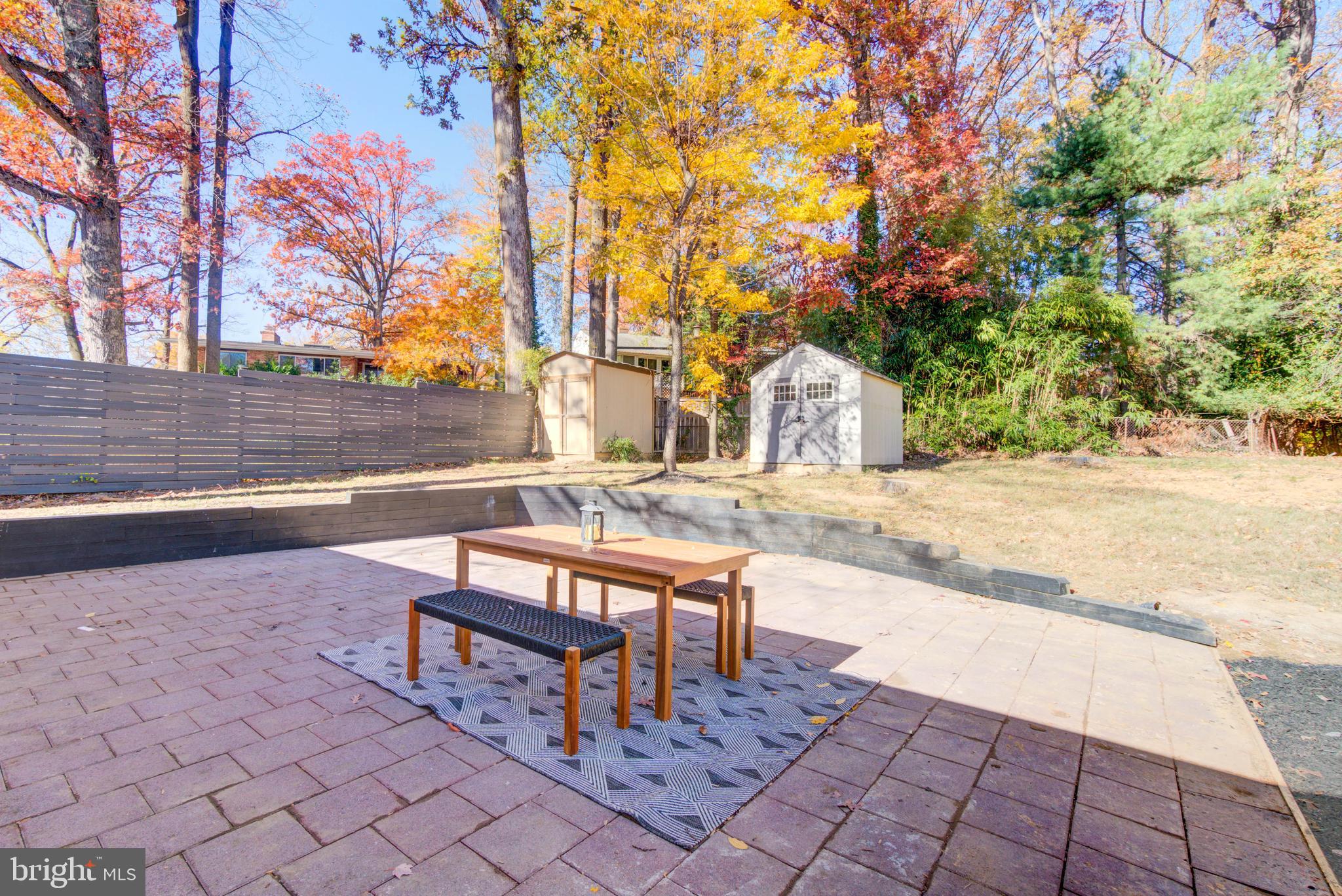 1206 La Grande Road Silver Spring, MD 20903 - Photo 37 of 45 a bench is sitting in middle of a yard