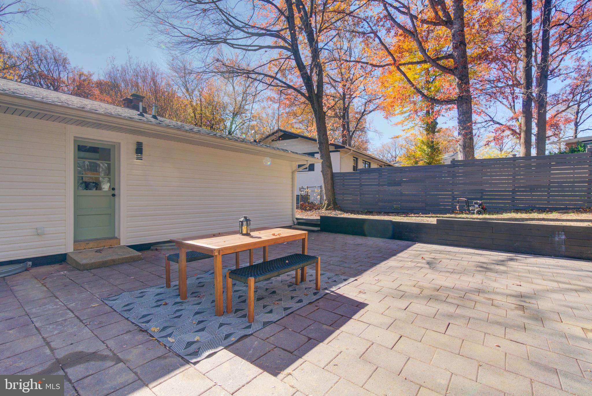 1206 La Grande Road Silver Spring, MD 20903 - Photo 38 of 45 a backyard of a house with barbeque oven and outdoor seating