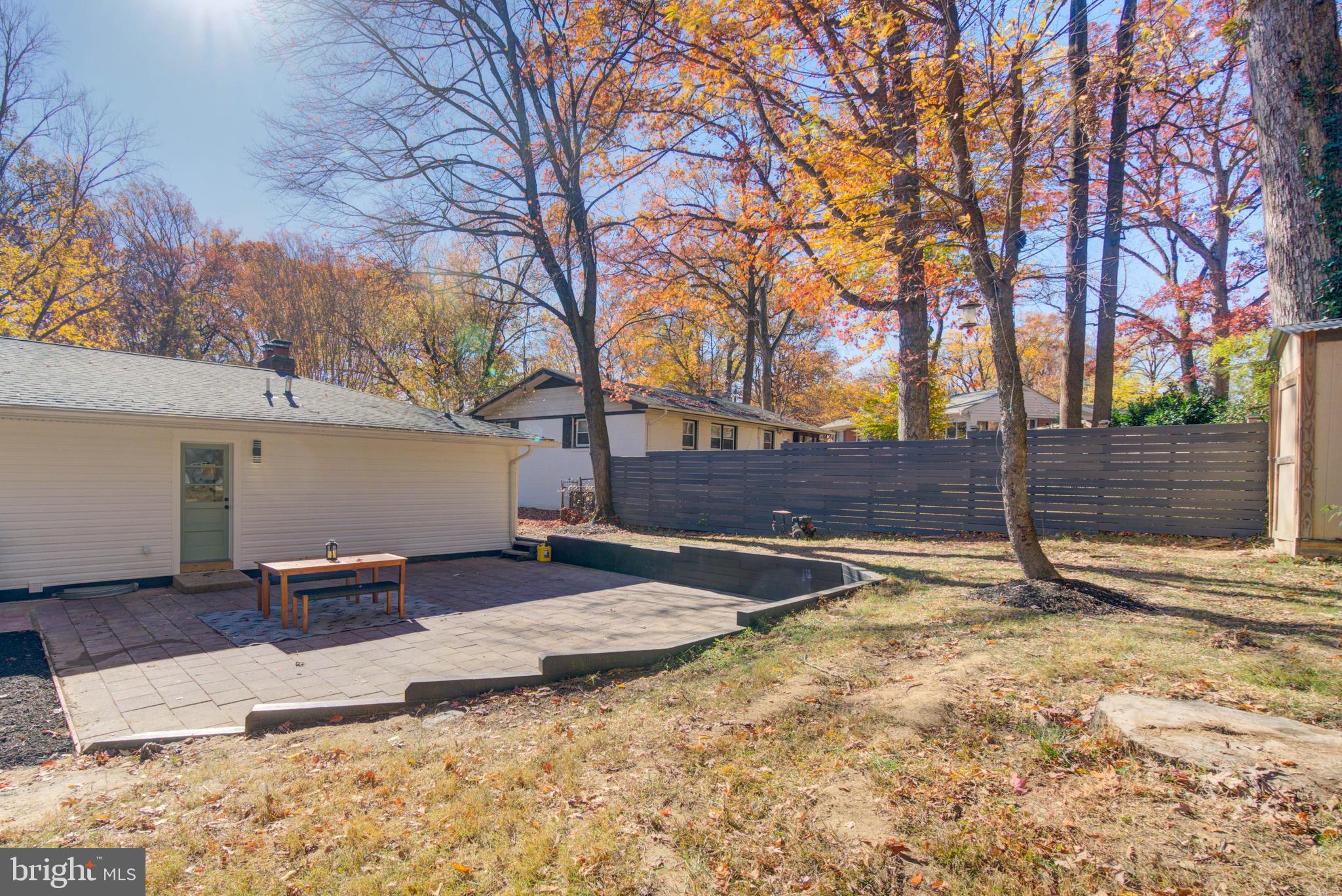 1206 La Grande Road Silver Spring, MD 20903 - Photo 39 of 45 a backyard of a house with table and chairs