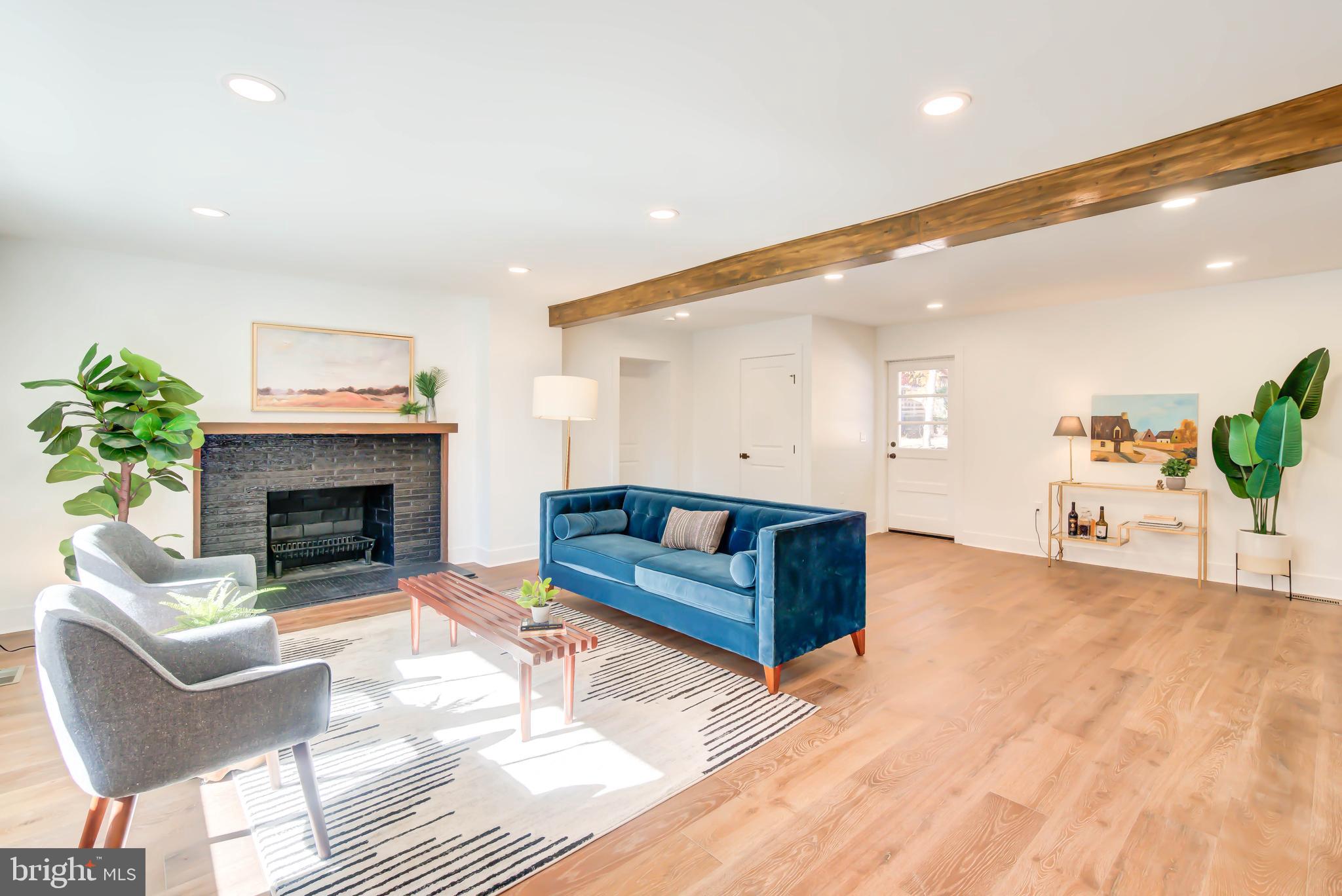 1206 La Grande Road Silver Spring, MD 20903 - Photo 4 of 45 a living room with furniture and a fireplace