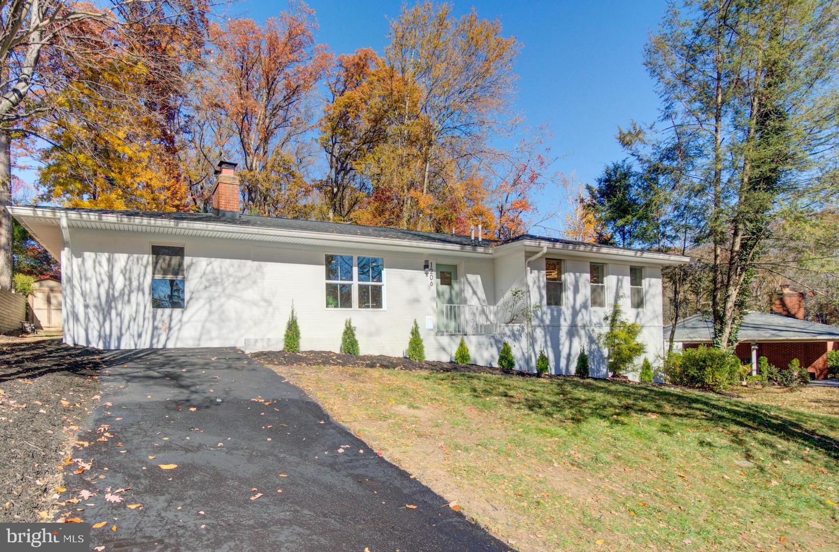1206 La Grande Road Silver Spring, MD 20903 - Photo 42 of 45 a front view of a house with a yard and garage