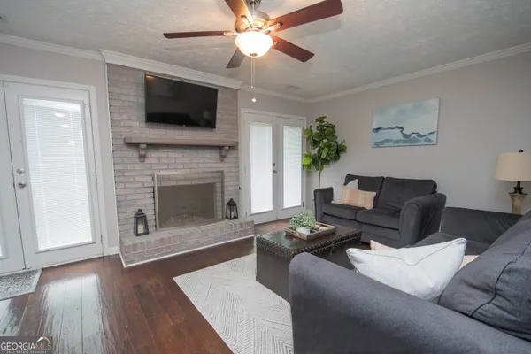 a living room with furniture and a fireplace