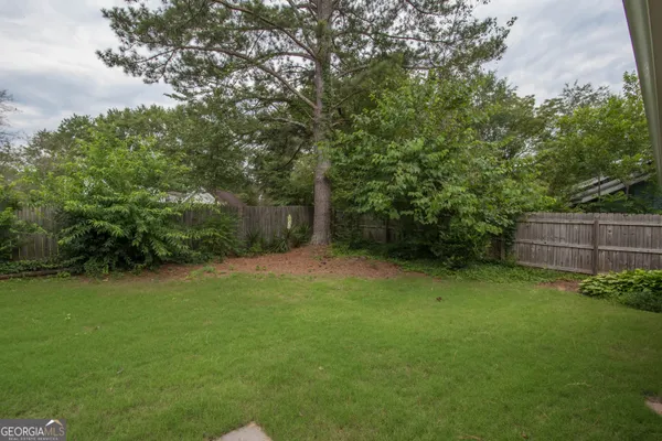 a view of a backyard with a trees
