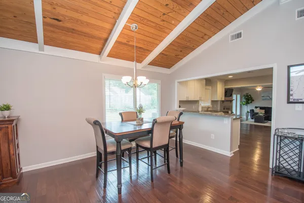 a dining room with furniture and window