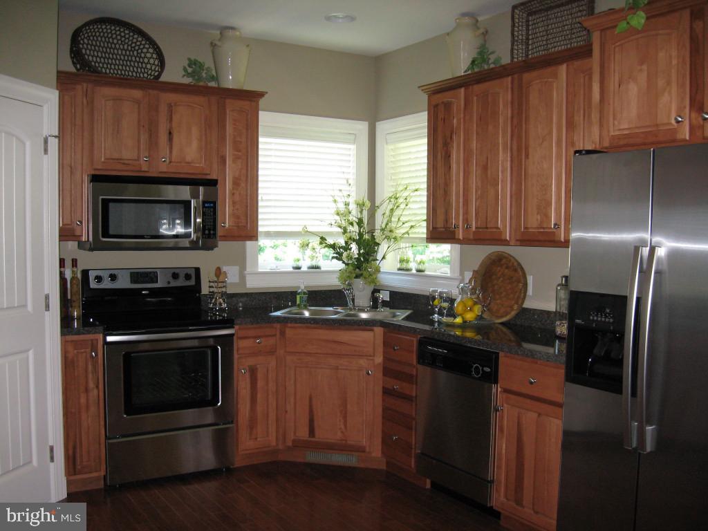 139 Baneberry Lane, Unit 15 Lititz, PA 17543 - Photo 3 of 9 a kitchen with a sink stove and refrigerator