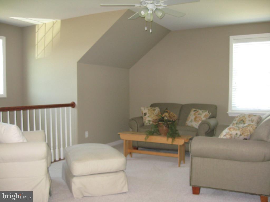 139 Baneberry Lane, Unit 15 Lititz, PA 17543 - Photo 9 of 9 a living room with furniture and a couch