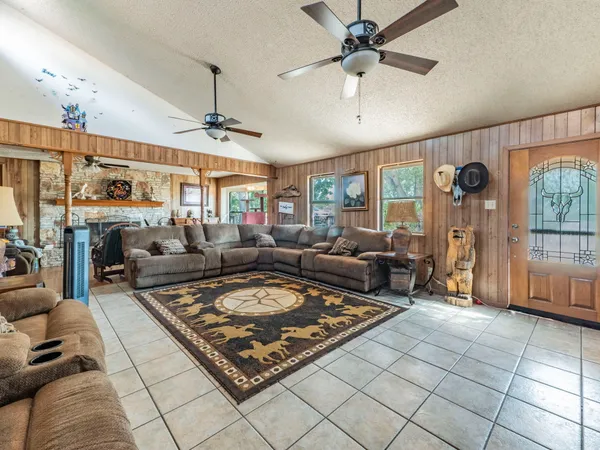 a living room with furniture and a table
