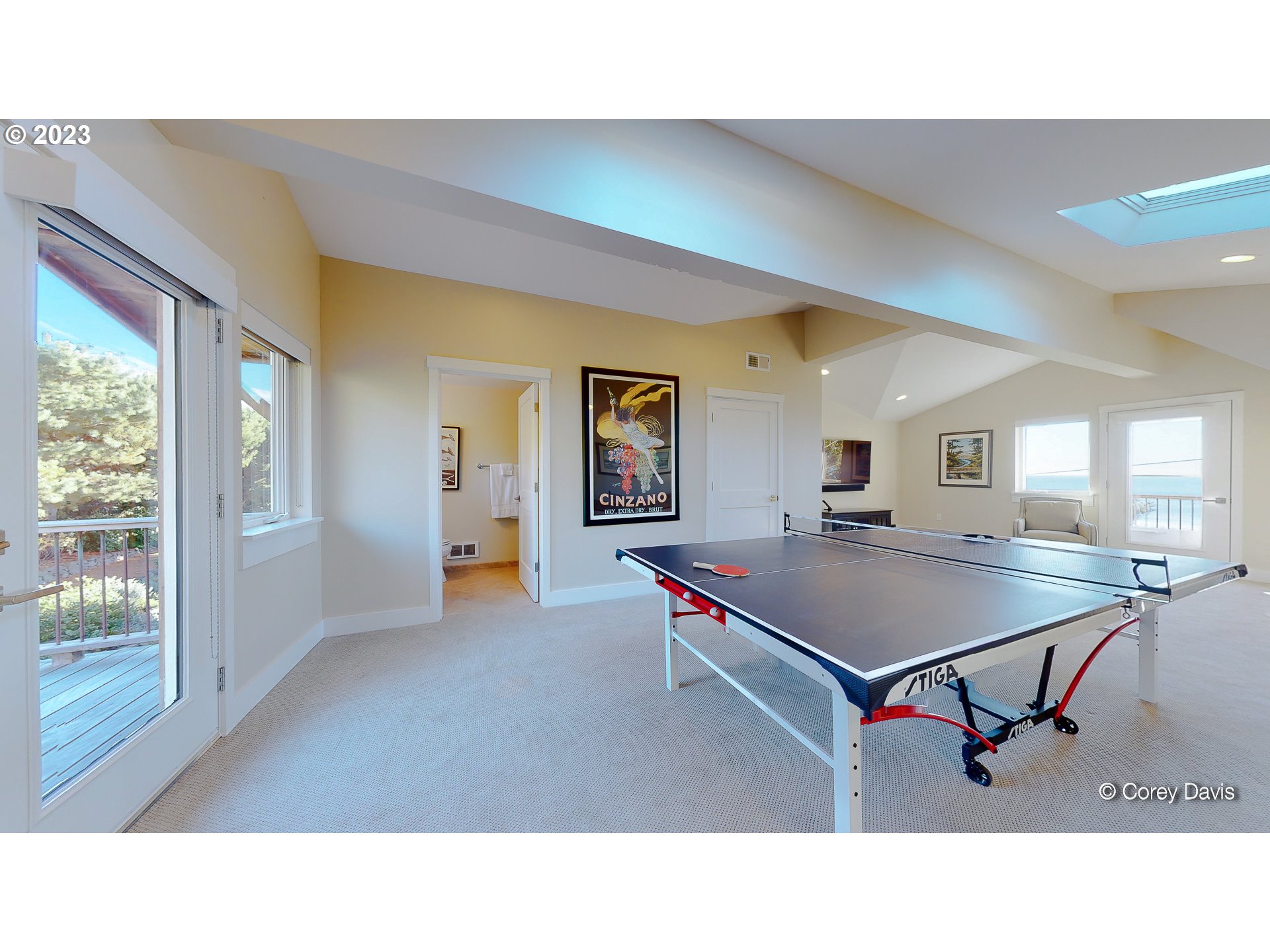 37995 Beulah Reed Road Nehalem, OR 97131 - Photo 24 of 32 a living room with a table tennis table and a flat screen tv