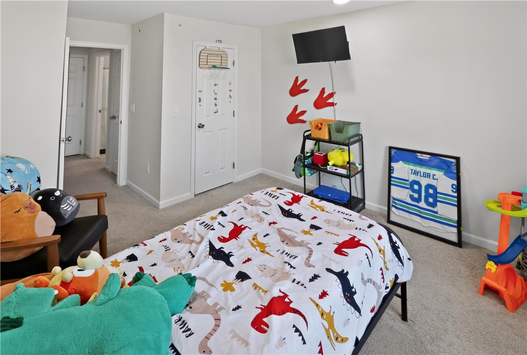 4502 Benjamin Court Emmaus, PA 18049 - Photo 36 of 48 A well-lit bedroom provides comfortable living with soft carpeting and convenient access to an adjacent room.