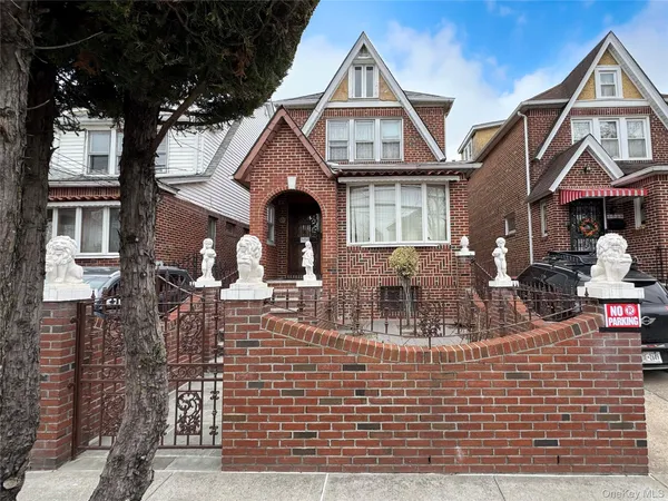 a front view of a house with glass windows