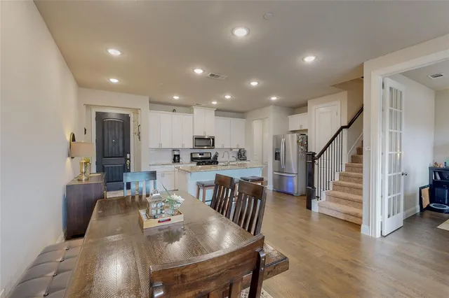 a view of kitchen with cabinets and wooden floor