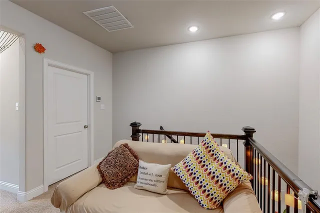 a bedroom with a bed and a lamp