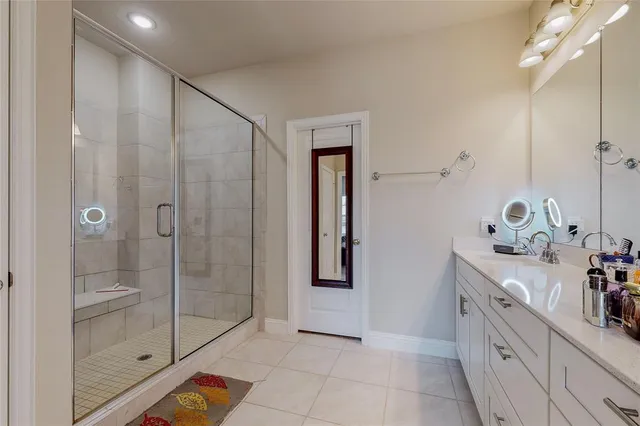 a bathroom with a shower and a sink