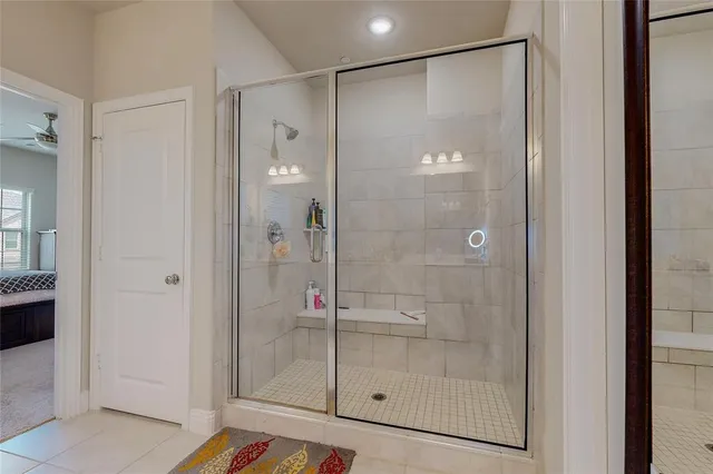 a bathroom with a shower and a sink