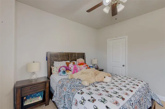 a bedroom with a bed and a fireplace