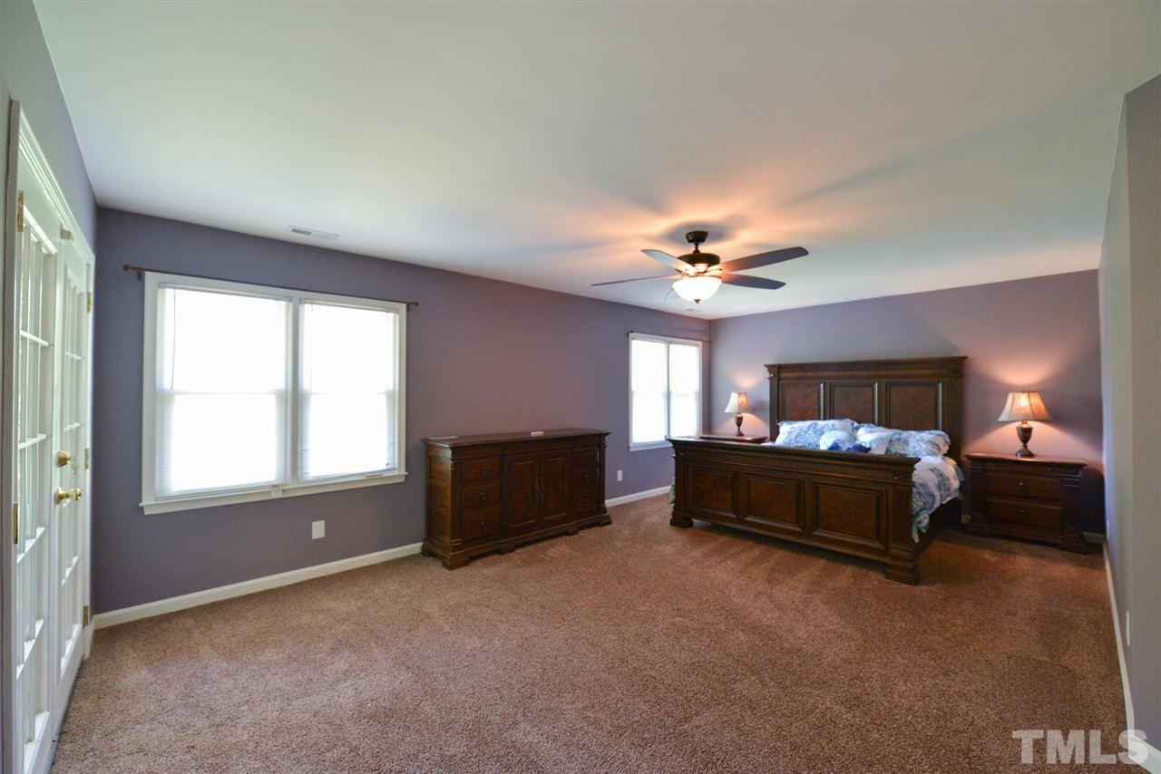 5321 Middleton Road Durham, NC 27713 - Photo 3 of 5 a living room with furniture and a chandelier