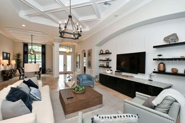 5507 Arnie Loop Lakewood Ranch, FL 34211 - Photo 17 of 68 a living room with furniture and a flat screen tv