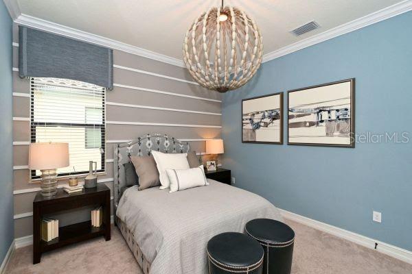 5507 Arnie Loop Lakewood Ranch, FL 34211 - Photo 21 of 68 a bedroom with a bed and a window
