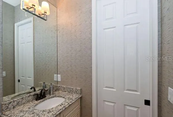 a bedroom with a bed and ceiling fan