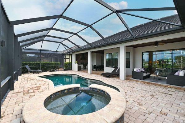 5507 Arnie Loop Lakewood Ranch, FL 34211 - Photo 38 of 68 a view of a swimming pool with outdoor seating