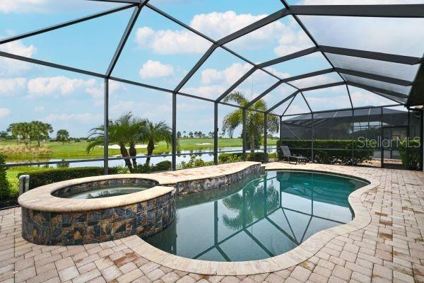 5507 Arnie Loop Lakewood Ranch, FL 34211 - Photo 39 of 68 a view of a swimming pool with a lounge chairs