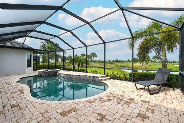 5507 Arnie Loop Lakewood Ranch, FL 34211 - Photo 41 of 68 a view of a swimming pool with a porch