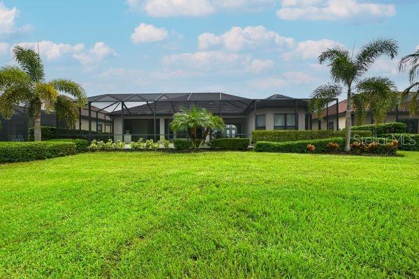 5507 Arnie Loop Lakewood Ranch, FL 34211 - Photo 47 of 68 a front view of house with yard and green space