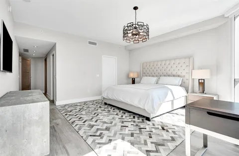 a view of a lake with houses in the back